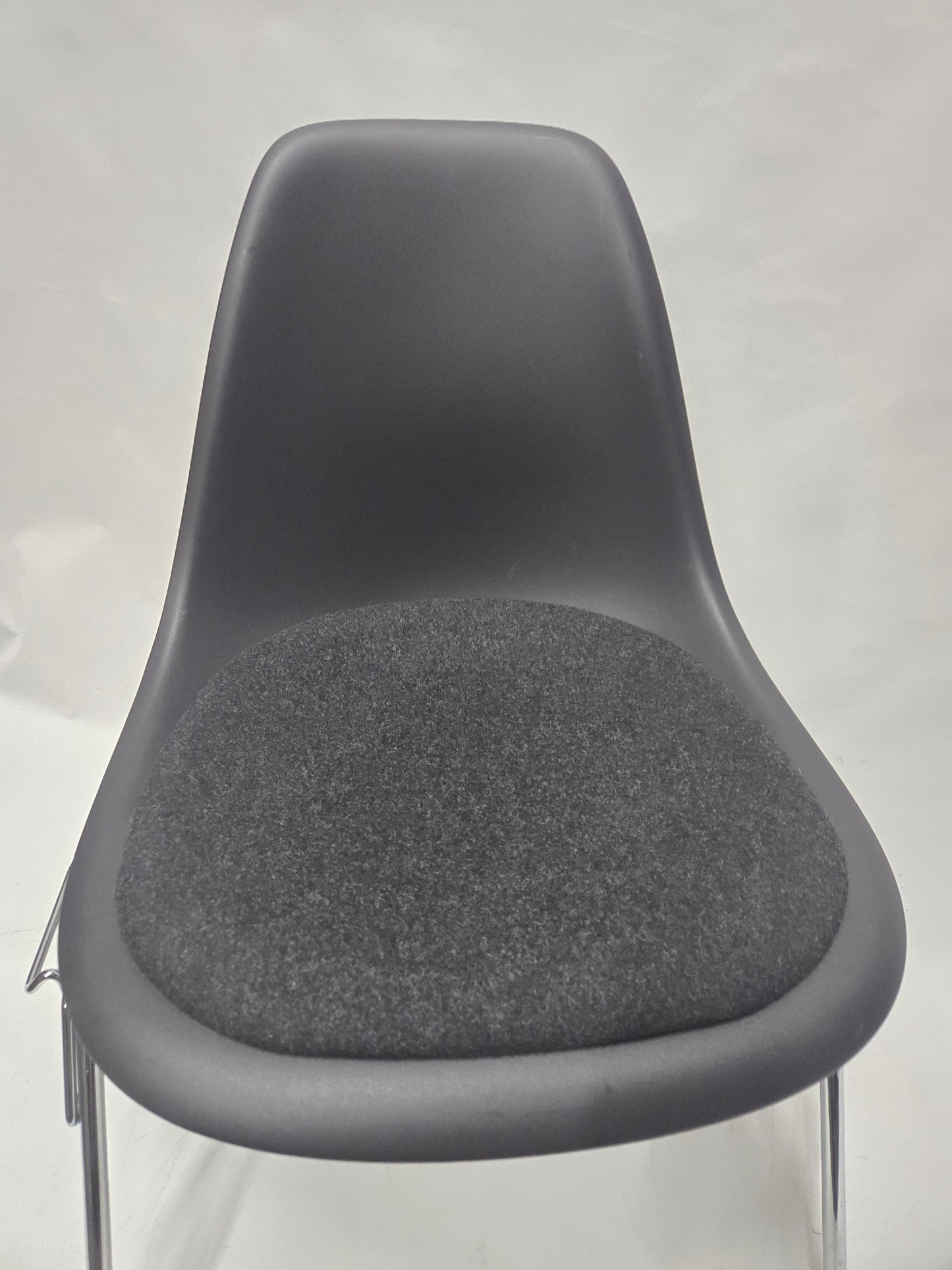 Vitra Eames Plastic Molded Chair in Black with Grey Cushion