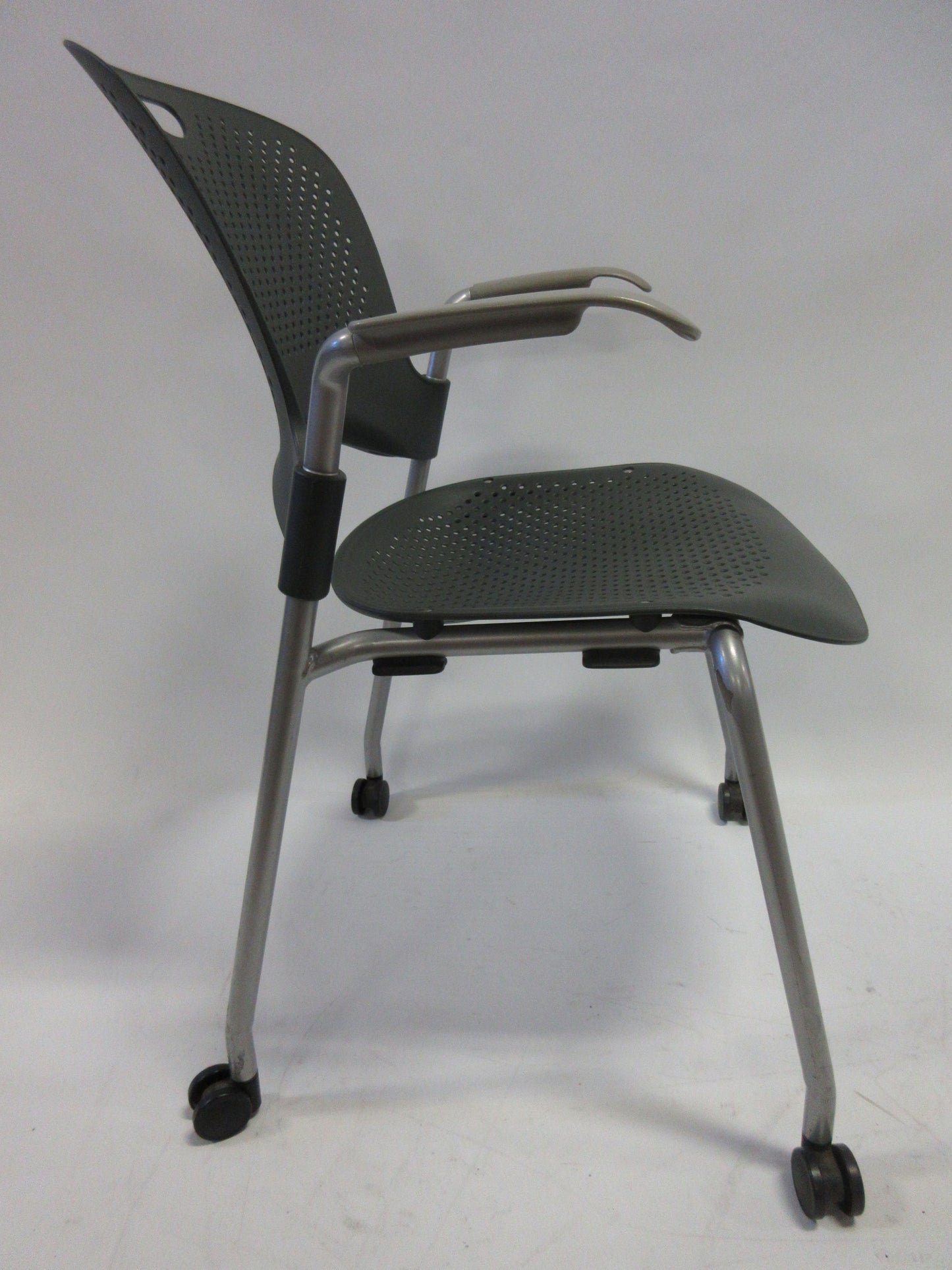 Herman Miller Caper Armchair in Black with Plastic Seat, Grey Legs and Wheels