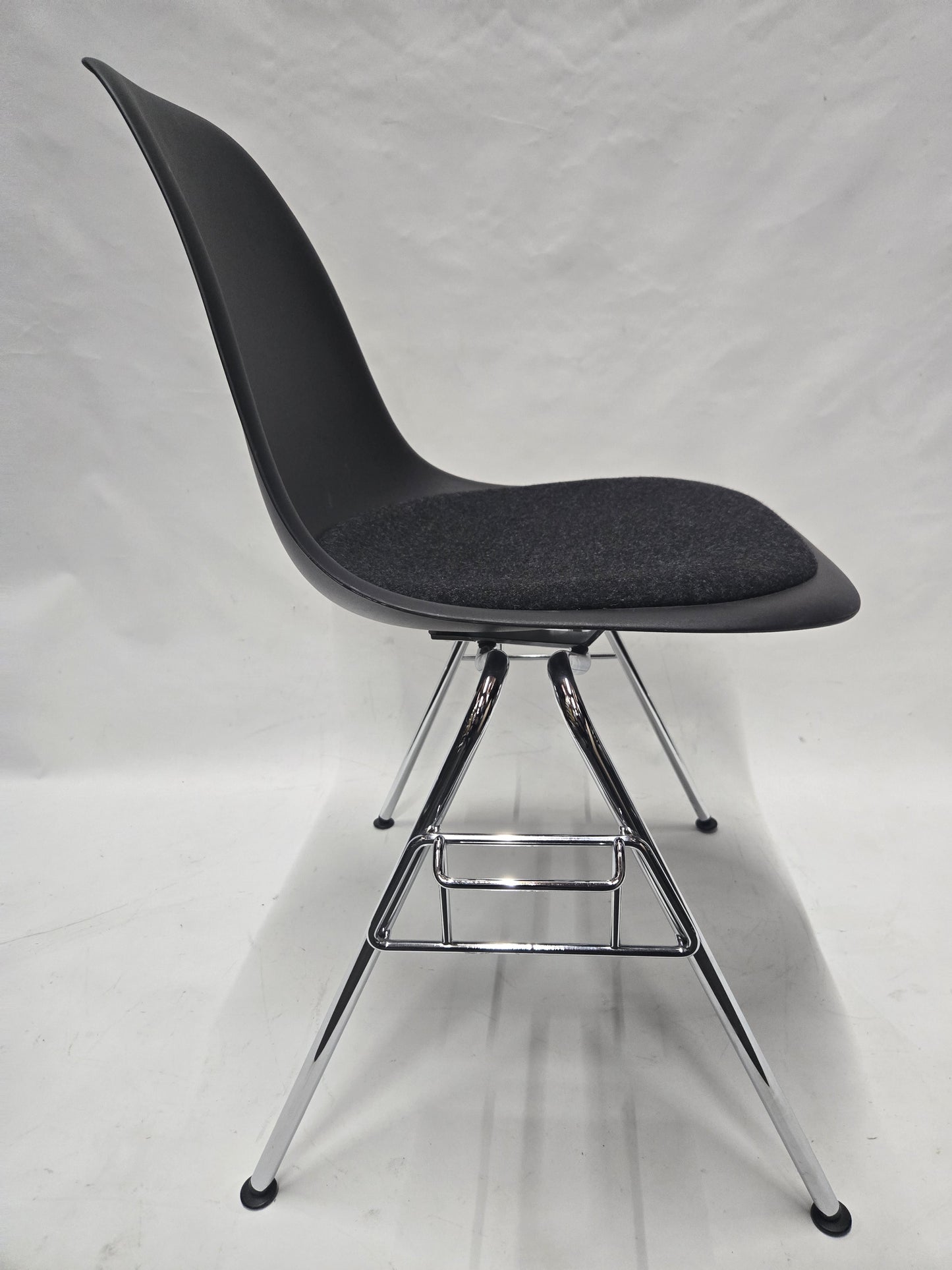 Vitra Eames Plastic Molded Chair in Black with Grey Cushion