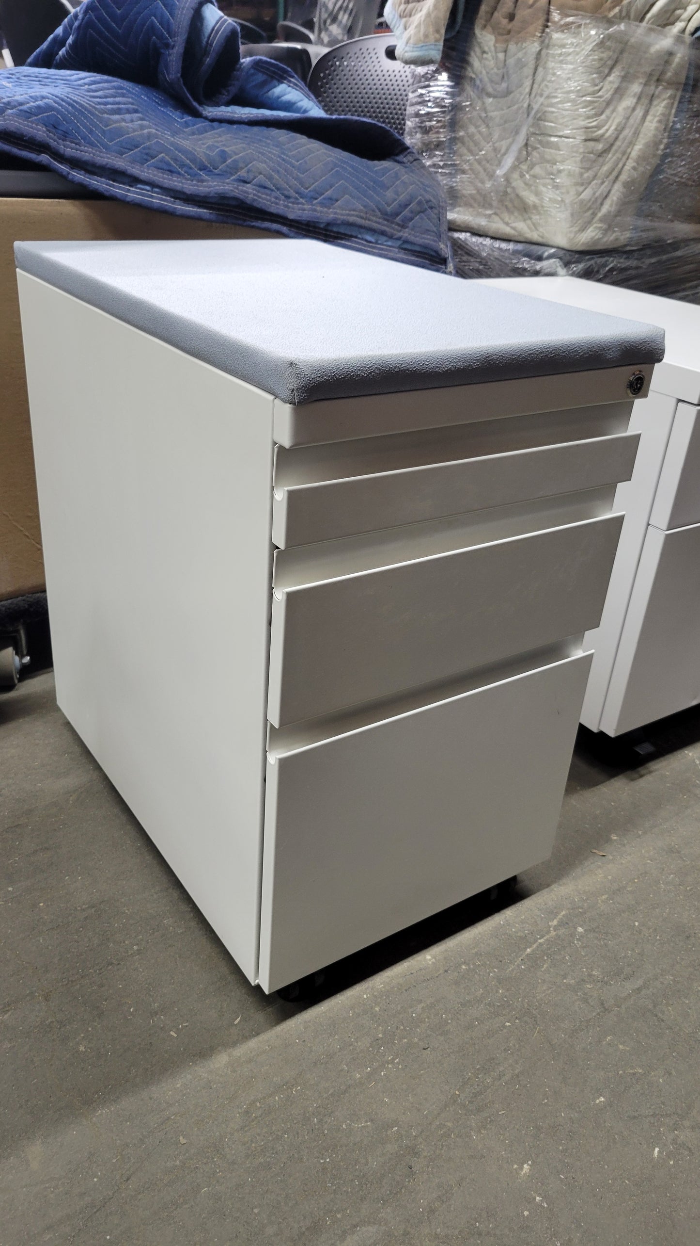 Haworth Three-Drawer Mobile Filing Pedestal in White with Upholstered Seat in Light Blue / Grey