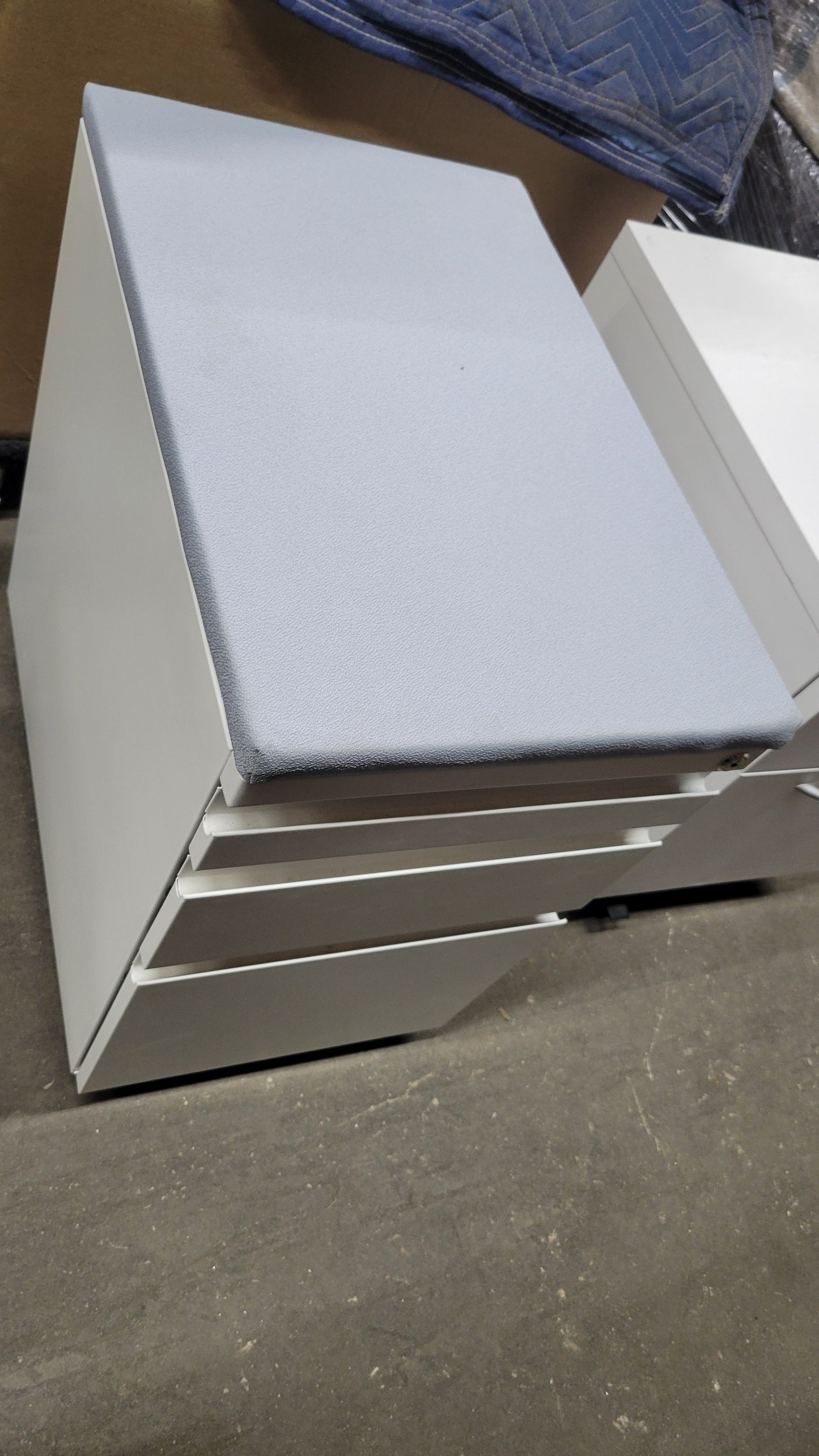 Haworth Three-Drawer Mobile Filing Pedestal in White with Upholstered Seat in Light Blue / Grey