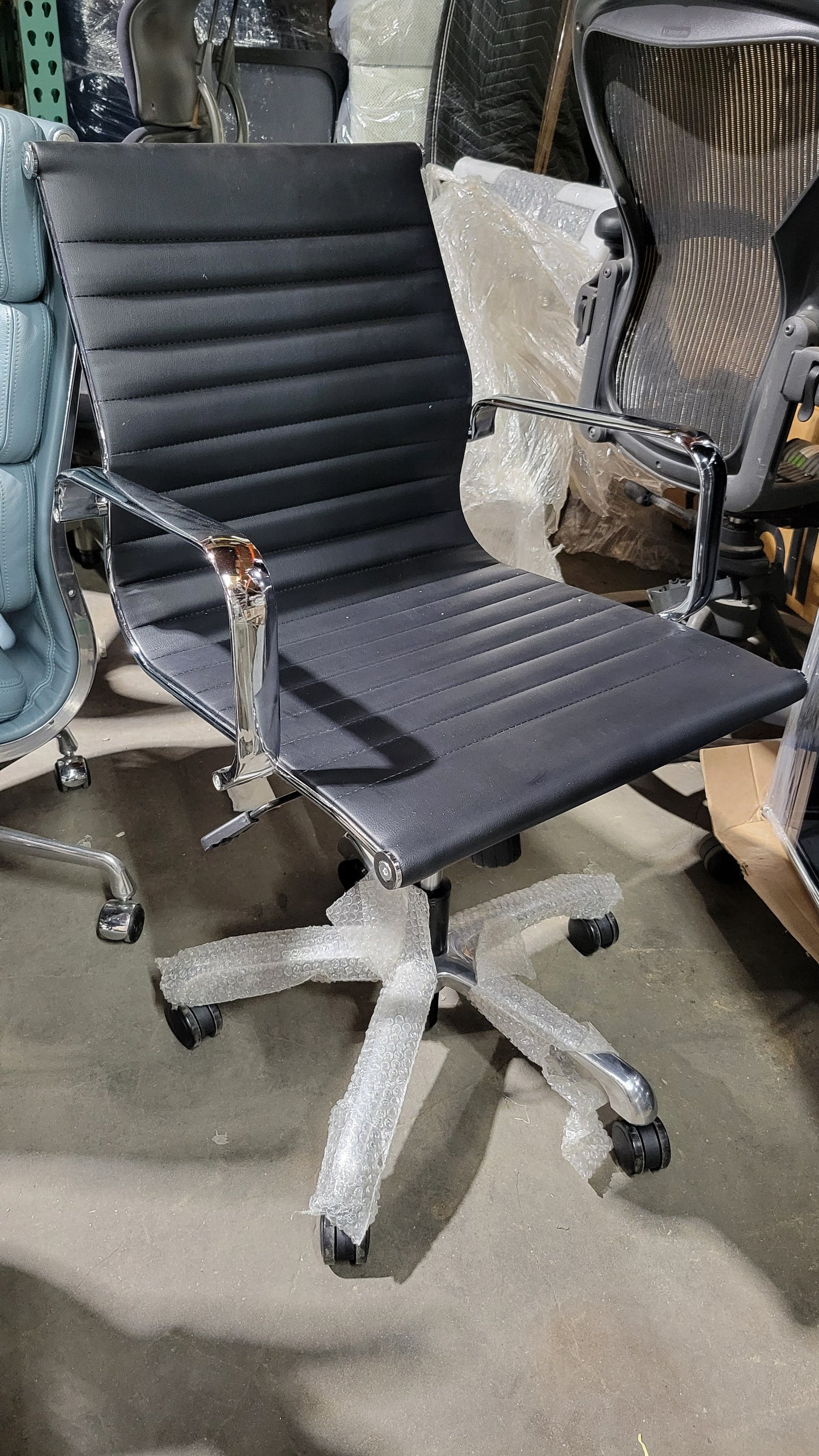 Woodstock Janis Low Back Conference Chair in Black Eco-Leather