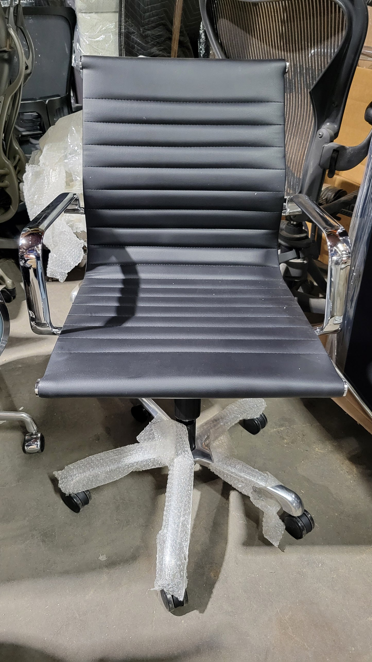 Woodstock Janis Low Back Conference Chair in Black Eco-Leather